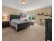 Comfortable bedroom with neutral walls, one window, and classic dark furnishings at 1804 Bella Casa Ct, Tampa, FL 33618