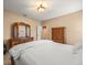 Bedroom featuring a wooden dresser, wardrobe and white bedding at 1804 Bella Casa Ct, Tampa, FL 33618