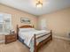 Bedroom featuring a wood bed frame and shuttered window at 1804 Bella Casa Ct, Tampa, FL 33618