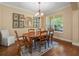 Dining room featuring hardwood floors, decorative mirror, and natural light at 1804 Bella Casa Ct, Tampa, FL 33618