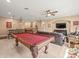 Second story game room with bar, pool table, TV, and foosball table at 1804 Bella Casa Ct, Tampa, FL 33618