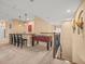 Loft game room area with a foosball table, bar counter with chairs, and railing overlooking the lower level at 1804 Bella Casa Ct, Tampa, FL 33618