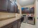 Laundry room featuring modern appliances and ample counter space at 1804 Bella Casa Ct, Tampa, FL 33618