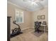 Bright office with exercise equipment, a ceiling fan and a built in desk at 1804 Bella Casa Ct, Tampa, FL 33618