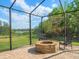 Enjoy outdoor gatherings on the brick patio with a cozy stone fire pit and serene backyard views at 1804 Bella Casa Ct, Tampa, FL 33618