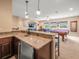 Home wet bar with stone countertops at 1804 Bella Casa Ct, Tampa, FL 33618