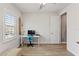 Comfortable room features a clean desk next to a shuttered window for natural light at 18872 Noble Caspian Dr, Lutz, FL 33558