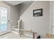 Stylish entryway featuring a decorative door, wooden floors, and staircase at 18872 Noble Caspian Dr, Lutz, FL 33558