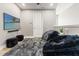 Entertainment room featuring a large TV, beanbag chairs, and a soft grey rug at 18872 Noble Caspian Dr, Lutz, FL 33558