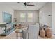 Living room with stylish decor, plantation shutters, and an open layout at 18872 Noble Caspian Dr, Lutz, FL 33558