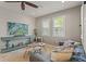 Cozy living room with plantation shutters, modern decor, and ample natural light at 18872 Noble Caspian Dr, Lutz, FL 33558