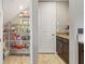 Pantry with ample shelving for storage, located off the kitchen area at 18872 Noble Caspian Dr, Lutz, FL 33558