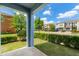 Covered patio with view of the manicured lawn and the neighboring homes and landscaping at 18872 Noble Caspian Dr, Lutz, FL 33558