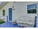 This home features a relaxing, blue porch seating area, perfect for enjoying quiet moments at 1920 30Th E Ave, Bradenton, FL 34208