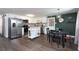 Open kitchen featuring stainless steel appliances, granite countertops, and an island cart for added prep space at 1920 30Th E Ave, Bradenton, FL 34208