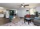 Open concept living room with adjacent dining area and view into the modern kitchen at 1920 30Th E Ave, Bradenton, FL 34208