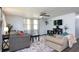 Inviting living room featuring a plush sectional sofa, ceiling fan, and streaming television at 1920 30Th E Ave, Bradenton, FL 34208