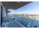 Balcony with a view of the waterfront showcasing the canal, boats, and nearby homes on a sunny day at 223 Island Way # 5E, Clearwater Beach, FL 33767
