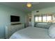 Well-lit bedroom with mirrored closets, a neutral color scheme, and a bright atmosphere at 223 Island Way # 5E, Clearwater Beach, FL 33767