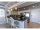 Modern kitchen featuring stainless steel appliances, granite countertops, and stylish pendant lighting at the breakfast bar at 223 Island Way # 5E, Clearwater Beach, FL 33767