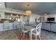 Open-concept living space featuring a dining area, kitchen bar and comfortable seating with scenic views at 223 Island Way # 5E, Clearwater Beach, FL 33767
