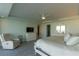 Open main bedroom featuring serene decor, sitting area, and water views at 223 Island Way # 5E, Clearwater Beach, FL 33767