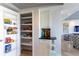 Spacious walk-in pantry with organized shelving, offering ample storage space for your groceries at 223 Island Way # 5E, Clearwater Beach, FL 33767