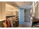 Spacious walk-in closet with custom organizers, shelving, drawers, and ample hanging space for clothing and accessories at 223 Island Way # 5E, Clearwater Beach, FL 33767