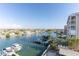 Gorgeous waterfront view featuring docks and boats under a clear blue sky at 223 Island Way # 5E, Clearwater Beach, FL 33767