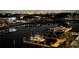 Picturesque waterfront view at night, showing boats docked along the canal at 223 Island Way # 5E, Clearwater Beach, FL 33767