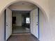 Open entryway featuring a tiled floor and arched doorway leading into the home's interior at 23059 Geneva Rd, Land O Lakes, FL 34639