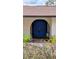 Charming entryway with a bright blue double door and well-maintained landscaping at 23059 Geneva Rd, Land O Lakes, FL 34639