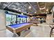 The game room has two pool tables, stools, tile flooring and recessed lighting at 23059 Geneva Rd, Land O Lakes, FL 34639