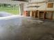 Spacious garage with workbench and shelving, ideal for storage and hobbies at 23059 Geneva Rd, Land O Lakes, FL 34639