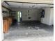 Spacious garage with workbench and shelving, ideal for storage and hobbies at 23059 Geneva Rd, Land O Lakes, FL 34639