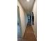 Hallway with carpet flooring leading to other areas of the home, showing neutral walls and good lighting at 23059 Geneva Rd, Land O Lakes, FL 34639