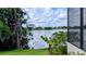 Tranquil lake views are framed by beautiful, mature trees at 23059 Geneva Rd, Land O Lakes, FL 34639