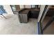 Covered outdoor kitchen features wooden cabinets, sink, and stylish countertop at 23059 Geneva Rd, Land O Lakes, FL 34639