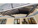 Charming outdoor patio with rustic ceiling beams and stylish blue and white accent tile at 23059 Geneva Rd, Land O Lakes, FL 34639