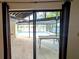 Covered patio area with a view of the screened-in pool, and direct lake access at 23059 Geneva Rd, Land O Lakes, FL 34639