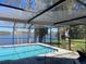 Screened pool with beautiful lake views and plenty of space for entertaining at 23059 Geneva Rd, Land O Lakes, FL 34639