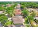Aerial view of the property featuring a well-manicured lawn and convenient backyard access at 2605 Durant Trails Blvd, Dover, FL 33527