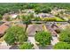 Aerial view of a property surrounded by lush greenery and neighboring homes at 2605 Durant Trails Blvd, Dover, FL 33527