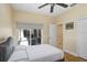 Bedroom featuring wood floors and a sliding glass door to the exterior at 2605 Durant Trails Blvd, Dover, FL 33527