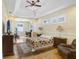 Serene bedroom suite features hardwood floors and tray ceiling at 2605 Durant Trails Blvd, Dover, FL 33527