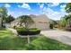 Well-maintained home with a long driveway, three-car garage, and neatly trimmed hedges at 2605 Durant Trails Blvd, Dover, FL 33527