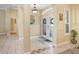 Inviting foyer features decorative tile and double entry doors at 2605 Durant Trails Blvd, Dover, FL 33527