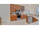 Well-equipped kitchen boasts stainless steel appliances and ample storage at 2605 Durant Trails Blvd, Dover, FL 33527