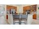 Charming kitchen with breakfast bar seating and warm wood cabinetry at 2605 Durant Trails Blvd, Dover, FL 33527