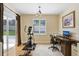 Bright office with an exercise machine, large window, and a neutral color palette at 2605 Durant Trails Blvd, Dover, FL 33527
